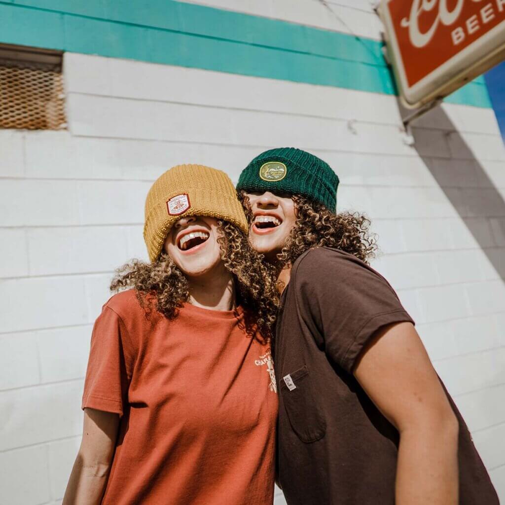 friends wearing travel nevada deso beanies