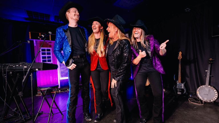 The Firelight Barn Dinner Theater bandmates pose for a photo and are dressed in black and colorful sequins blazers.