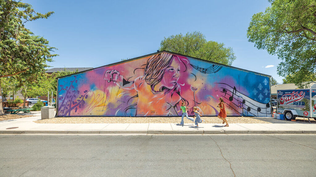 family outside brewery arts center mural in carson city nevada