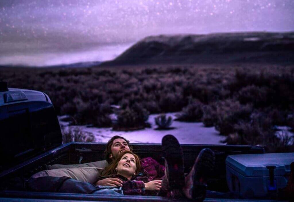couple camping under the stars in nevada