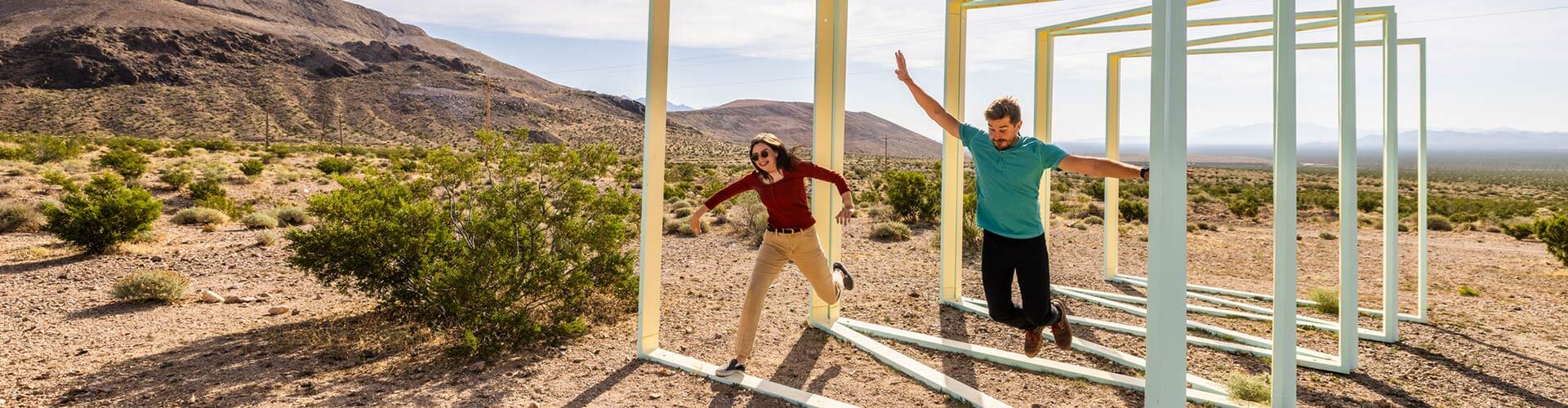couple interacting with a sculpture at goldwell open air museum in beatty nevada
