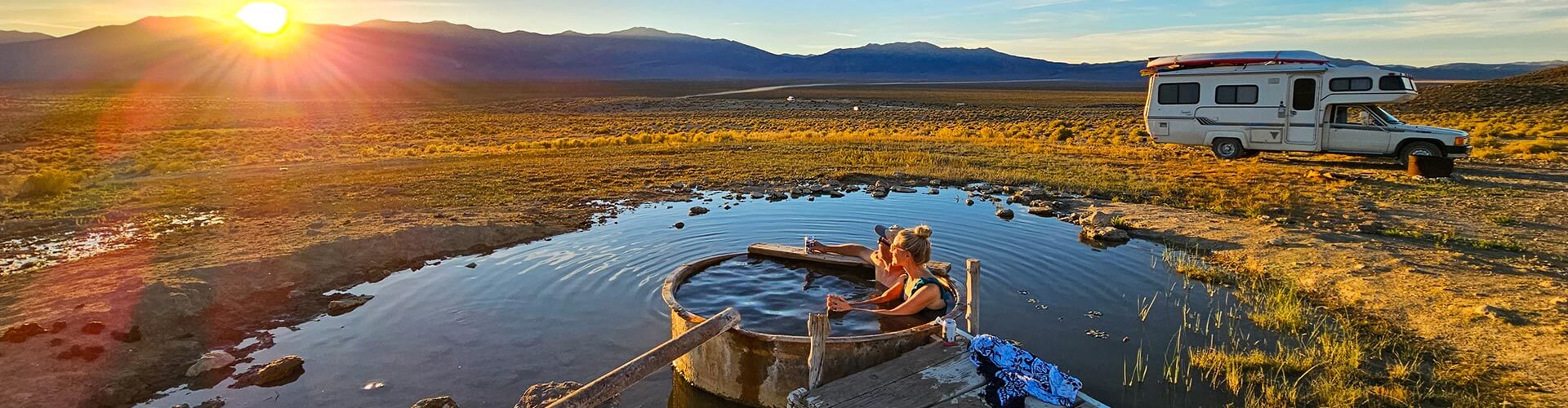 a couple soaking at spencer hot springs in nevada