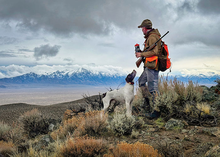 2026 great nevada picture hunt people winner scott mortimore photo of a man and hunting dog in the jackson mountains