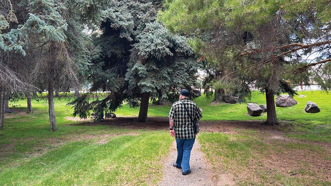 man walking in jackpot national forest next to cactus petes resort casino in jackpot nevada