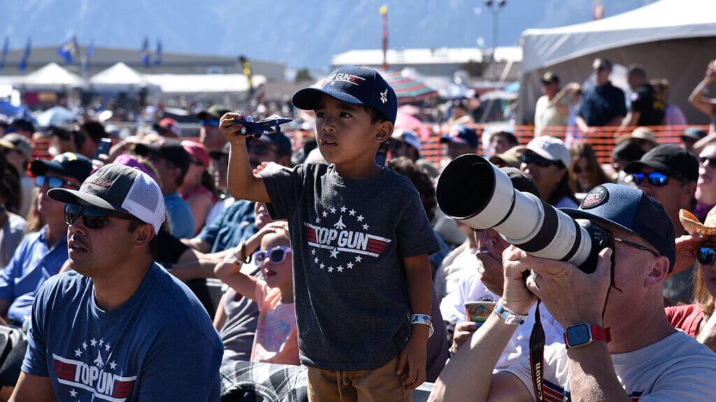 child with toy plane at minden-tahoe skyfest aviation show in minden carson valley nevada