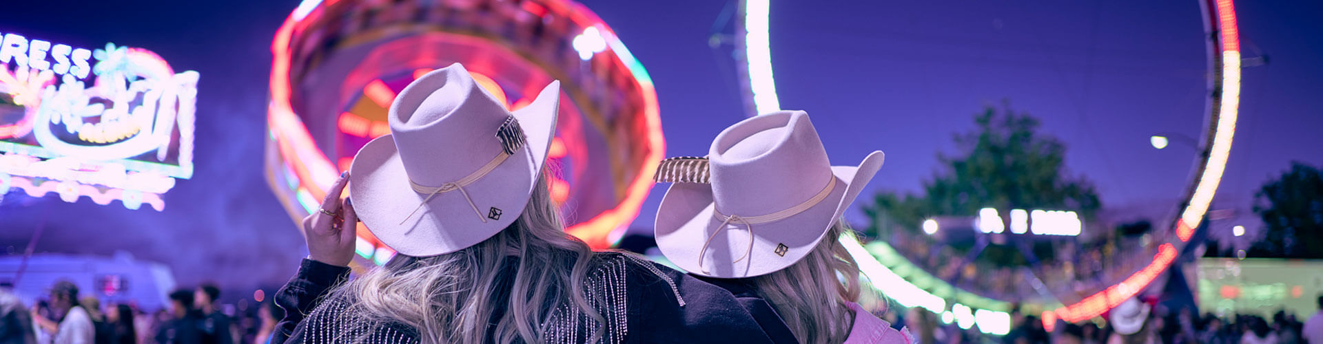 two women looking at carnival rides at the reno rodeo in reno nevada
