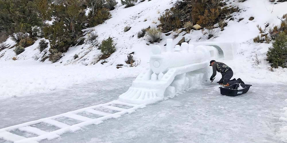 train sculpture made of snow and ice at fire & ice event in ely