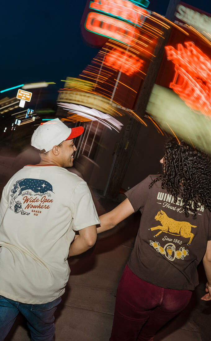 a man and women wearing deso supply co x travel nevada merch in winnemucca nv